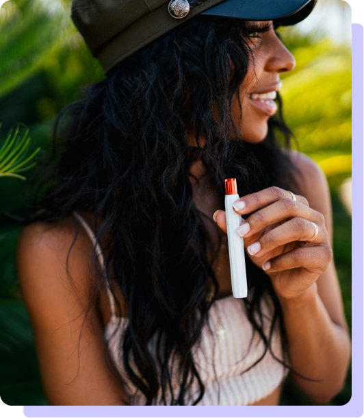 Airo Woman Holding Vape with Hat and Dark Hair