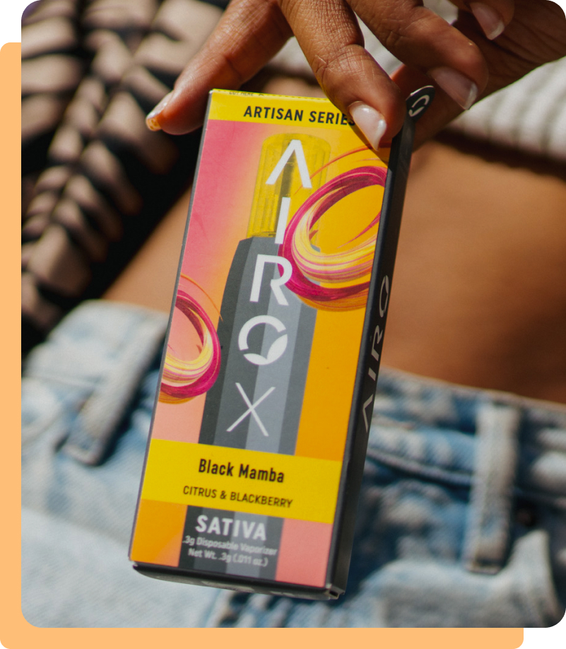 Woman Holding AIROX Black Mamba Disposable Vape Battery Package